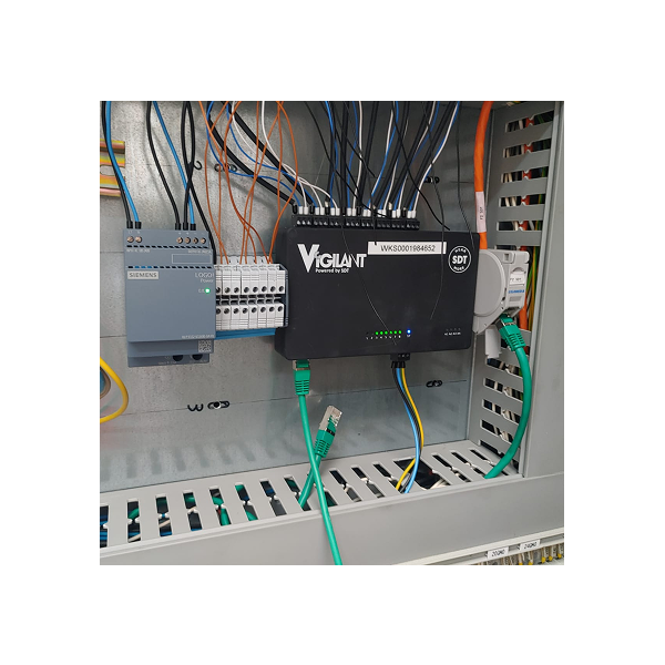 Vigilant Control Cabinet Installation Vigilant monitoring system installed inside an electrical control cabinet with connected Ethernet and sensor cables