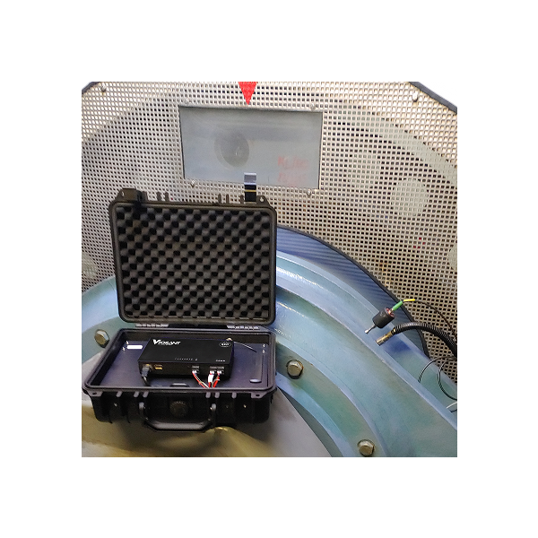 Vigilant System in Operation Vigilant monitoring unit in protective case deployed on rotating industrial equipment for live asset condition monitoring and analysis.