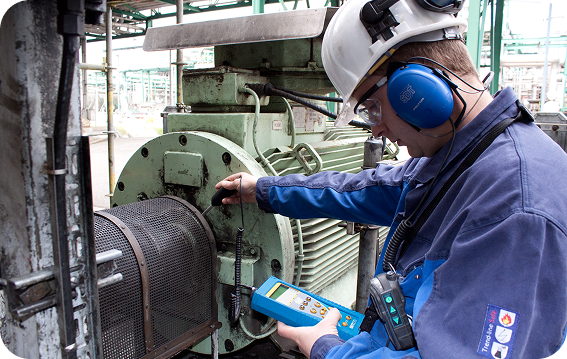 Ultrasound Detects Problems Before They Escalate Maintenance technician scanning an industrial motor with an SDT340 ultrasound device to detect friction and lubrication problems.