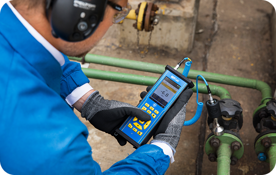 Proven Ultrasound Method for Valve Inspection Engineer performing valve inspection using SDT340 ultrasound device with contact probe.