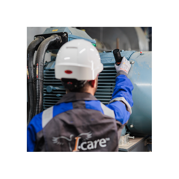 Wireless Vibration Inspection with Wi-care Pure Technician performing wireless vibration inspection on motor using Wi-care Pure sensor.