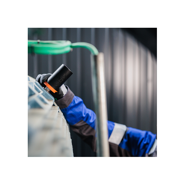 Wi-care Pure in Field Application Wi-care Pure wireless vibration sensor being applied to industrial equipment outdoors.