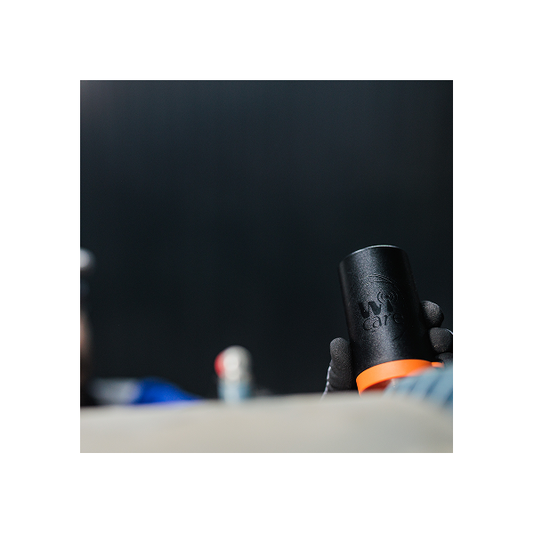 Wi-care in Use Wi-care wireless vibration sensor used by maintenance technician for remote equipment monitoring.