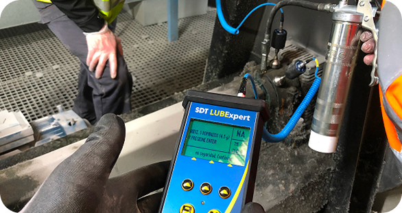 Technician performing ultrasound lubrication inspection during SDT Product Implementation Training.